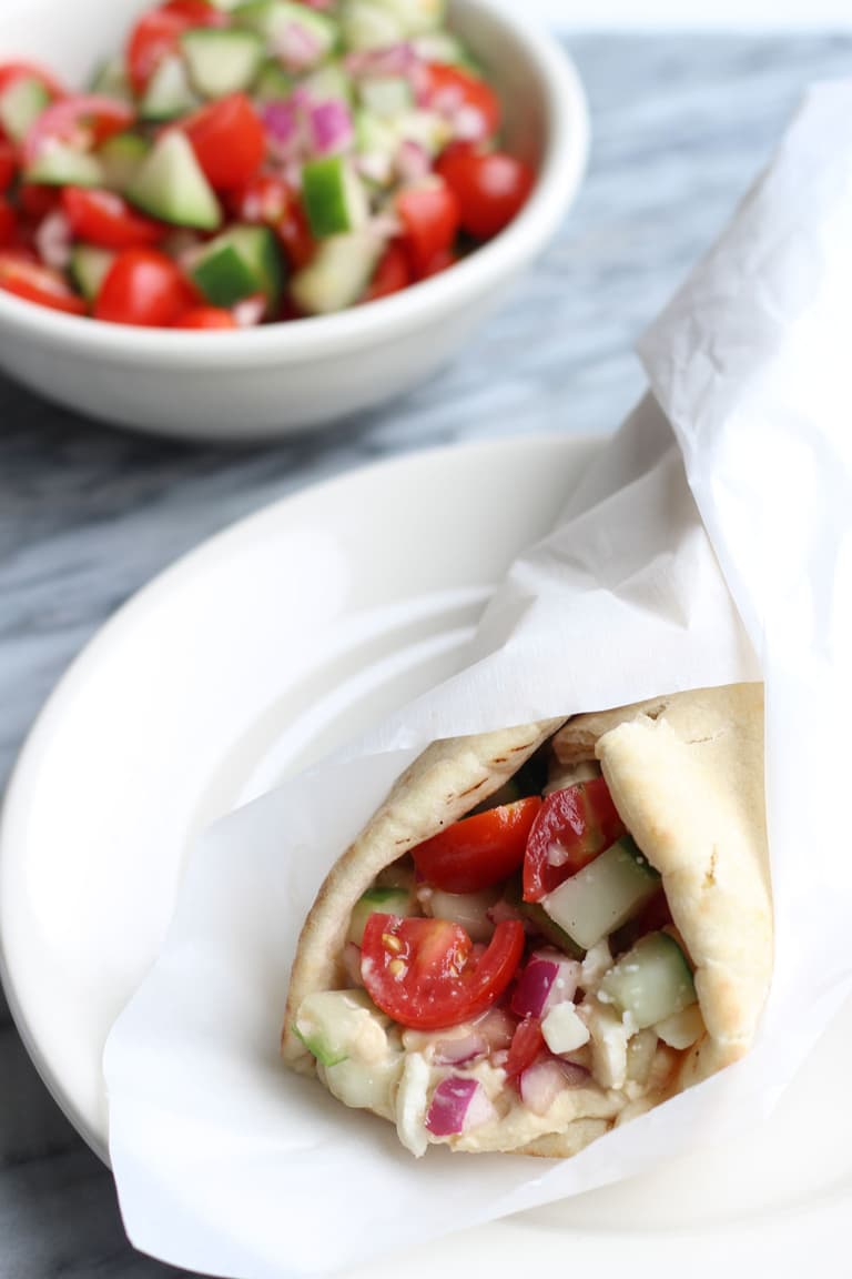 Image of Greek Salad and Hummus Wrap.
