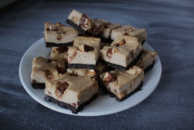 Image of Peanut Butter Snickers Cheesecake Bars.