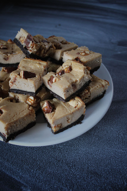Image of Peanut Butter Snickers Cheesecake Bars.